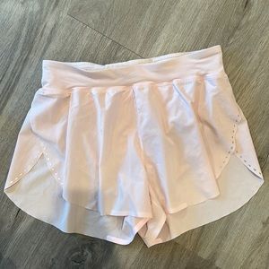 Light pink lululemon high waisted dolphin short